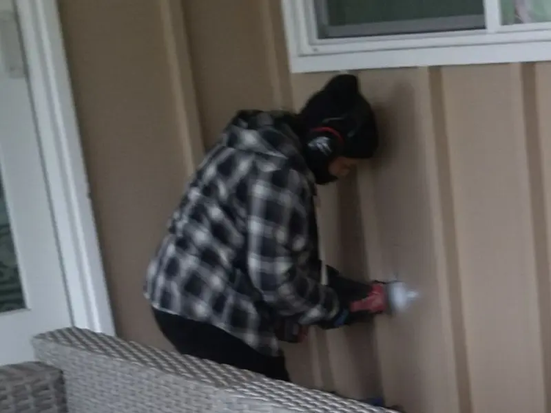 Professional electrician installing an exterior outlet in Point Pleasant